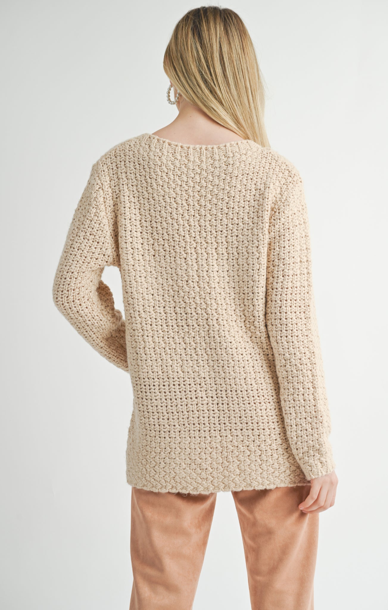 Stay cozy in the Sage the Label Maude sweater. Perfect for chilly days, this sweater will keep you warm and stylish. Made with high-quality fabric, it's comfortable and durable. A must-have for any wardrobe. (Sweater weather, anyone?)