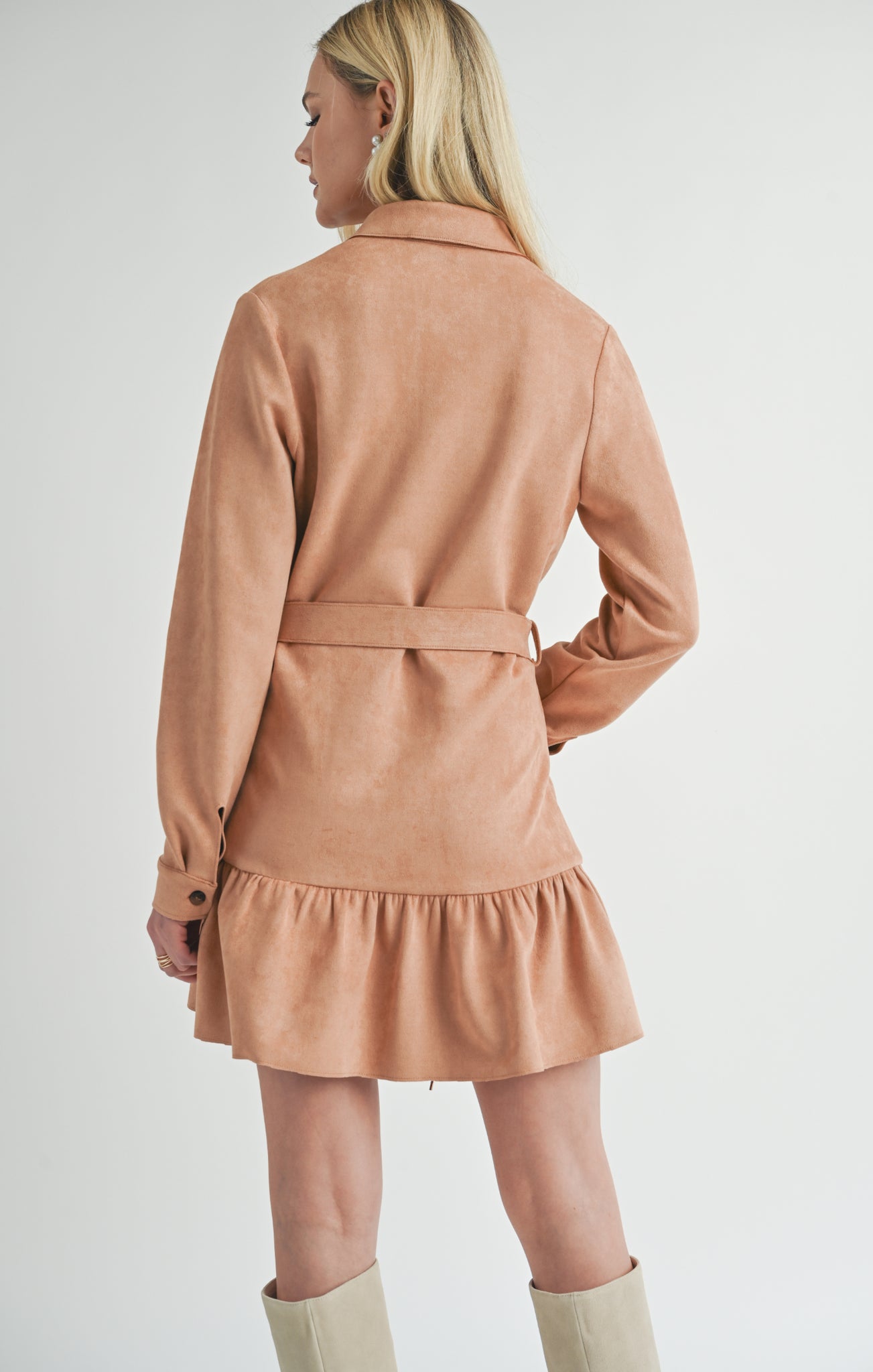 Turn heads in the Sage the Label Nurture mini dress, crafted from luxurious suede. This dress is all about indulgence, with its soft texture and flattering silhouette. Perfect for a night out or a special occasion, you'll feel confident and chic in this unique piece.