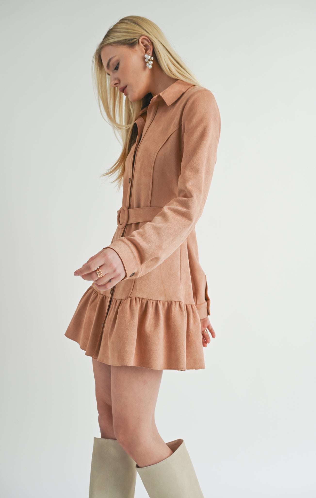 Turn heads in the Sage the Label Nurture mini dress, crafted from luxurious suede. This dress is all about indulgence, with its soft texture and flattering silhouette. Perfect for a night out or a special occasion, you'll feel confident and chic in this unique piece.