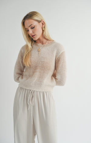 Wrap yourself in celestial style with the Sage the Label Reach for the Stars ombre sweater. This playful pullover features a unique ombre design and is the perfect statement piece for any starry-eyed fashionista. Reach for the stars and add this quirky sweater to your wardrobe today!