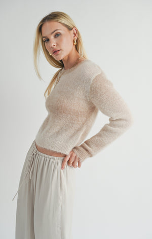 Wrap yourself in celestial style with the Sage the Label Reach for the Stars ombre sweater. This playful pullover features a unique ombre design and is the perfect statement piece for any starry-eyed fashionista. Reach for the stars and add this quirky sweater to your wardrobe today!