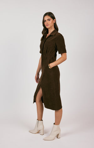 Unleash your paradoxical side with the Sage the Label cord shirt midi dress. This playful piece offers a unique twist on the classic shirt dress, making it a versatile addition to your wardrobe. Perfect for both work and play, it effortlessly combines comfort and style.