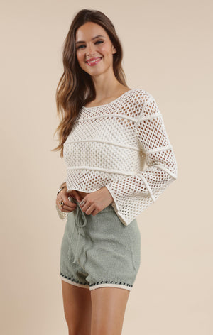 Embrace boho-chic vibes with our Poppy crochet bell sleeve sweater! This whimsical piece features dramatic bell sleeves that dance with your every move. Perfect for festival season or adding a touch of free-spirited charm to your everyday wardrobe. The intricate crochet detailing makes this sweater as unique as you are!