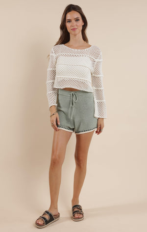 Embrace boho-chic vibes with our Poppy crochet bell sleeve sweater! This whimsical piece features dramatic bell sleeves that dance with your every move. Perfect for festival season or adding a touch of free-spirited charm to your everyday wardrobe. The intricate crochet detailing makes this sweater as unique as you are!
