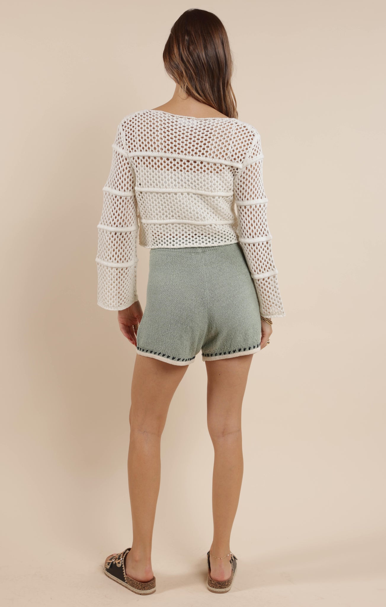 Embrace boho-chic vibes with our Poppy crochet bell sleeve sweater! This whimsical piece features dramatic bell sleeves that dance with your every move. Perfect for festival season or adding a touch of free-spirited charm to your everyday wardrobe. The intricate crochet detailing makes this sweater as unique as you are!