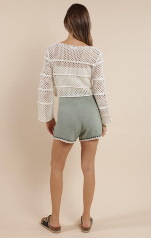 Embrace boho-chic vibes with our Poppy crochet bell sleeve sweater! This whimsical piece features dramatic bell sleeves that dance with your every move. Perfect for festival season or adding a touch of free-spirited charm to your everyday wardrobe. The intricate crochet detailing makes this sweater as unique as you are!