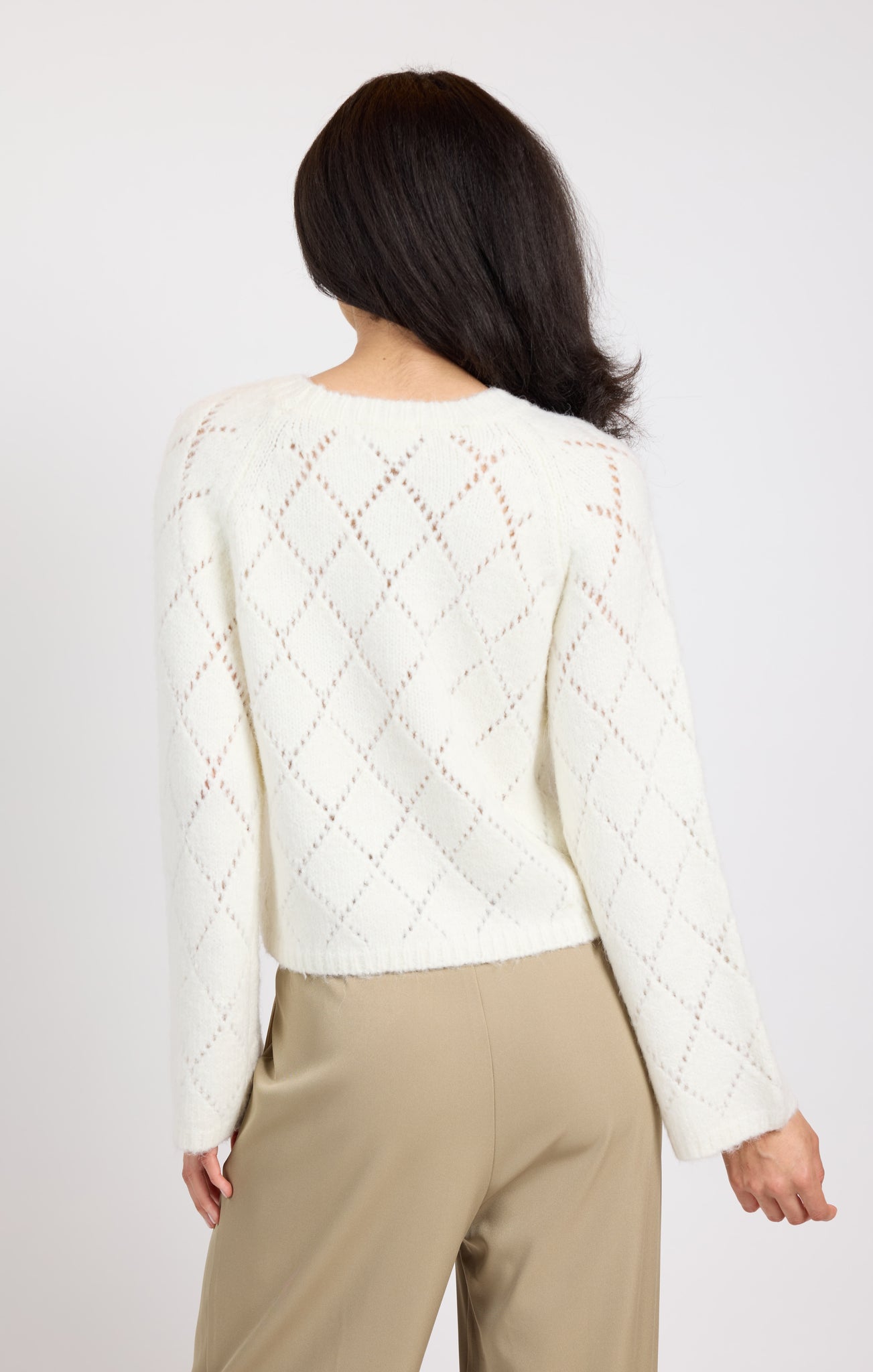 Stay cozy and chic in the Selena Diamond Pointelle Sweater by Sage the Label. With intricate diamond pointelle stitching, this sweater adds a touch of elegance to any outfit. Perfect for layering on chilly days or dressing up for a night out.