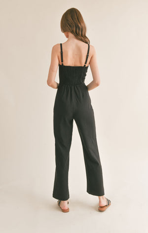 Be effortlessly chic in Sage the Label's Serene v cutout jumpsuit. This unique one-piece features a playful v cutout design, perfect for showing off your favorite accessories. Perfect for any occasion, this jumpsuit offers both style and comfort.