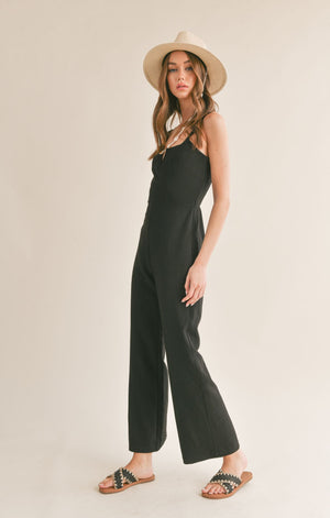 Be effortlessly chic in Sage the Label's Serene v cutout jumpsuit. This unique one-piece features a playful v cutout design, perfect for showing off your favorite accessories. Perfect for any occasion, this jumpsuit offers both style and comfort.