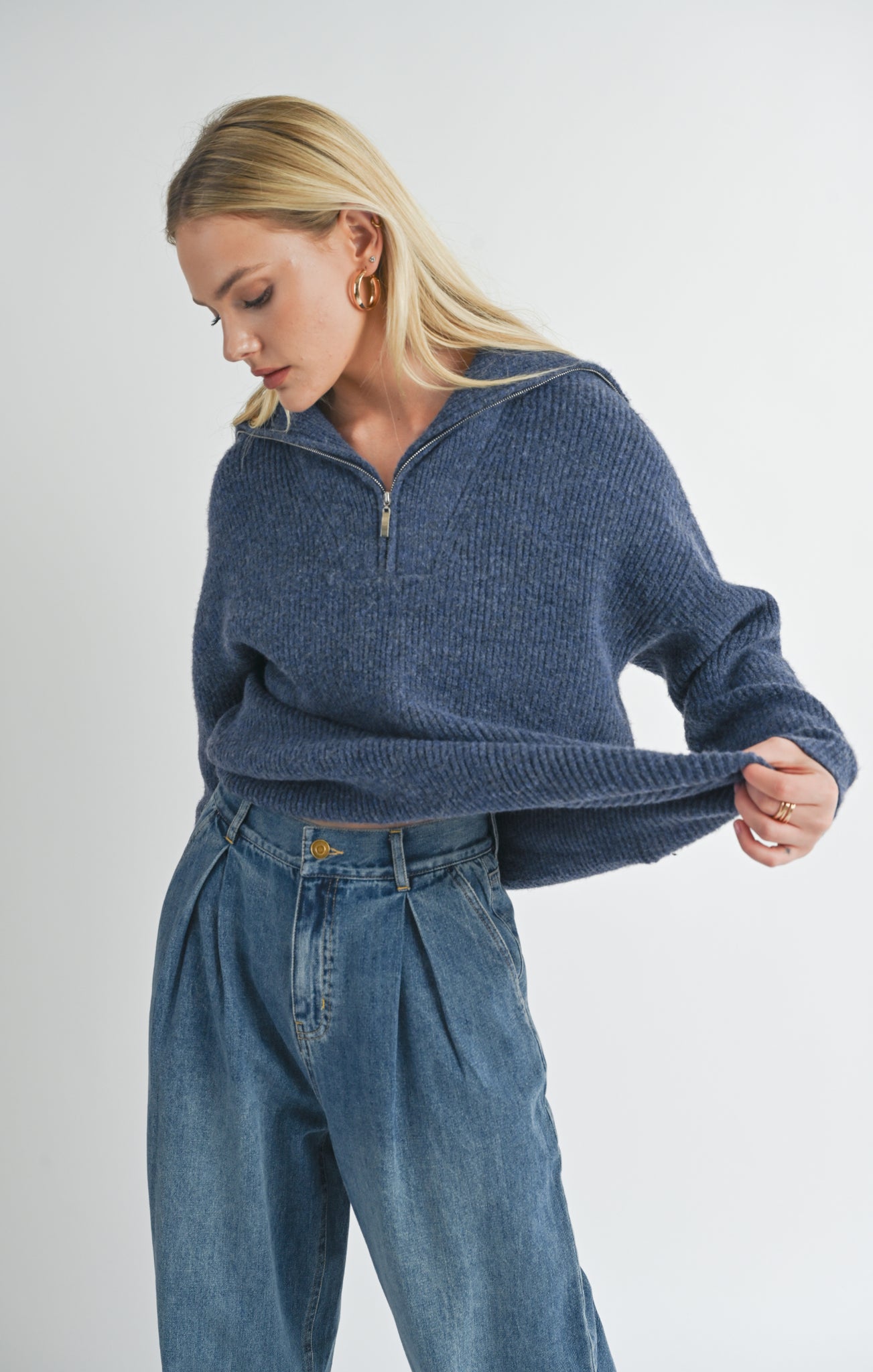 Introducing Suzy, the half zip sweater from Sage the Label. Stay warm and stylish with this quirky and playful sweater, perfect for any casual occasion. Don't zip up the boring sweater routine, zip up Suzy!