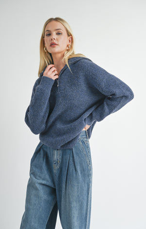 Introducing Suzy, the half zip sweater from Sage the Label. Stay warm and stylish with this quirky and playful sweater, perfect for any casual occasion. Don't zip up the boring sweater routine, zip up Suzy!