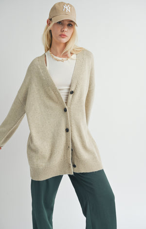 Introducing Sydney, the oversized cardigan from Sage the Label! Keep cozy in style with this whimsical knit piece. Perfect for layering or wearing on its own, Sydney will have you looking effortlessly chic. Say goodbye to boring cardigans and hello to playful fashion.