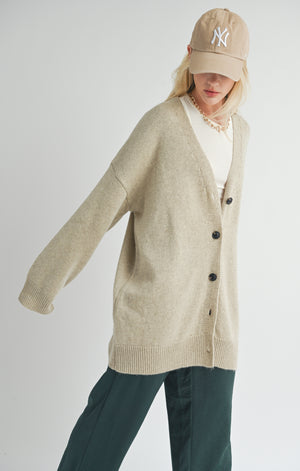 Introducing Sydney, the oversized cardigan from Sage the Label! Keep cozy in style with this whimsical knit piece. Perfect for layering or wearing on its own, Sydney will have you looking effortlessly chic. Say goodbye to boring cardigans and hello to playful fashion.