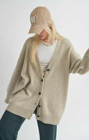 Introducing Sydney, the oversized cardigan from Sage the Label! Keep cozy in style with this whimsical knit piece. Perfect for layering or wearing on its own, Sydney will have you looking effortlessly chic. Say goodbye to boring cardigans and hello to playful fashion.