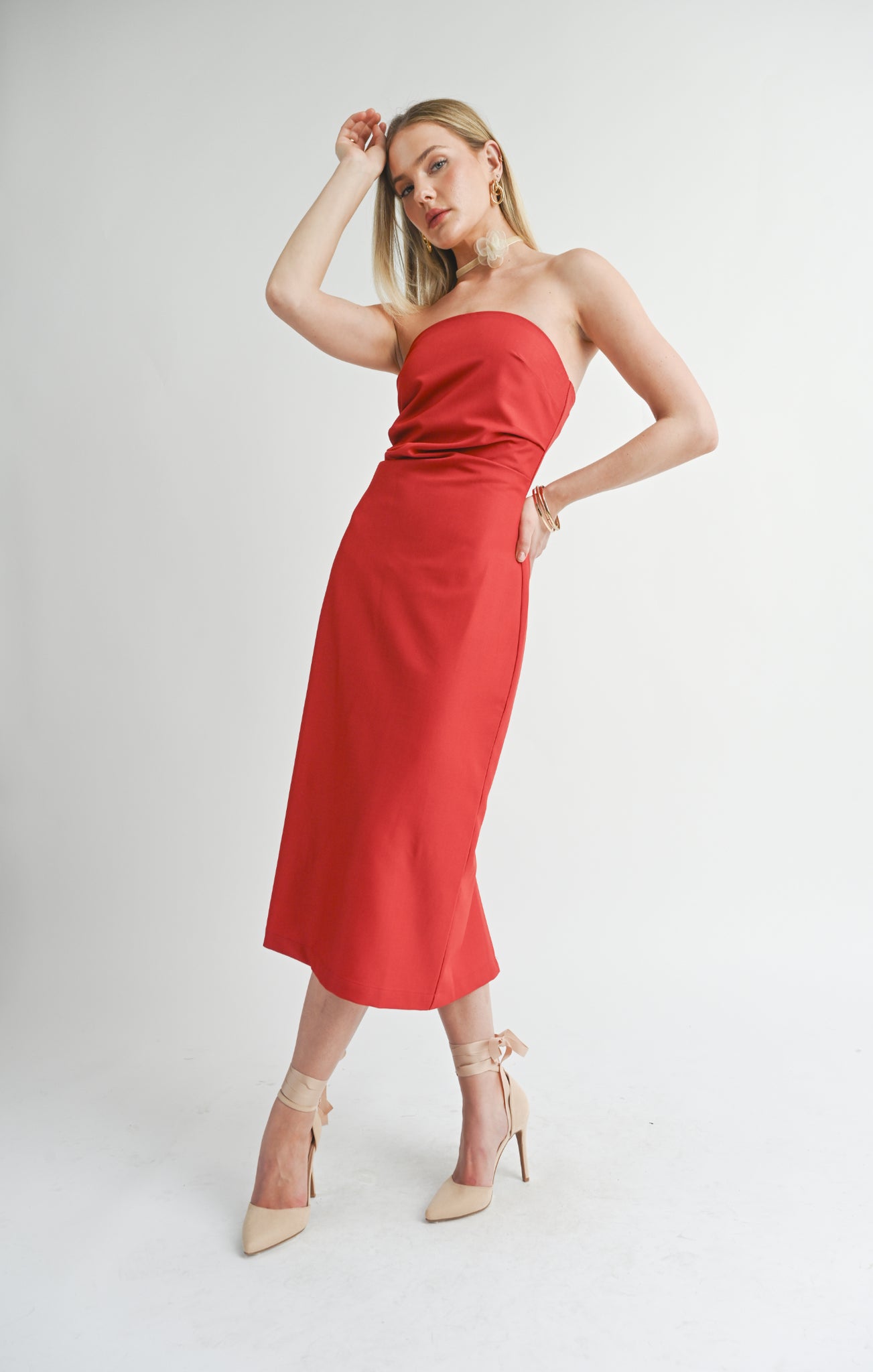 Turn heads and make moves in the Sage the Label Take Action Midi Dress. With its pleated tube design, this dress adds a touch of elegance and fun to any occasion.