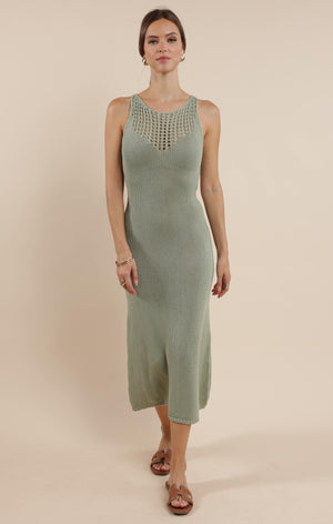 Slip into effortless style with The Breeze by Sage the Label. This open knit sweater dress combines cozy comfort with flirty details, perfect for breezy afternoons or sunset strolls. The airy knit pattern adds a touch of playful peek-a-boo charm while keeping you comfortably chic from brunch to beach and beyond!