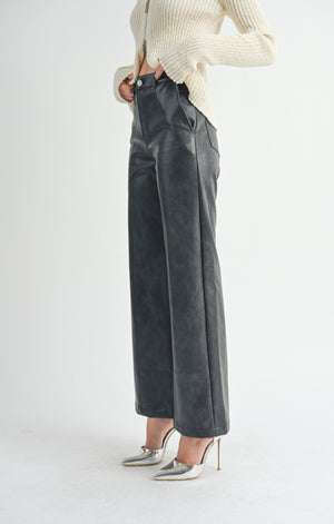 Unleash your inner rebel with Sage the Label's seamed vegan leather pants! These edgy pants are sure to make a statement while also being ethically conscious. Say goodbye to boring trousers and hello to a bold fashion choice.