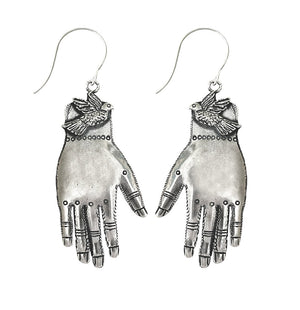 Silver hand-shaped earrings with a bird on a white background