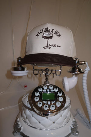 Vintage-style phone with a cap on top featuring 'Martinis & Men' text.
