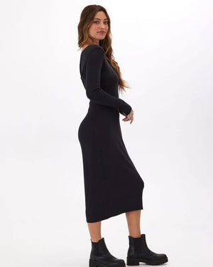 Twist and turn in style with the Threads 4 Thought Mira Dress. Made with feather rib fabric, this midi dress offers a playful and comfortable fit perfect for any occasion. Featuring a unique two-way twist and long sleeves, it's the perfect addition to your wardrobe for a fun and stylish look!