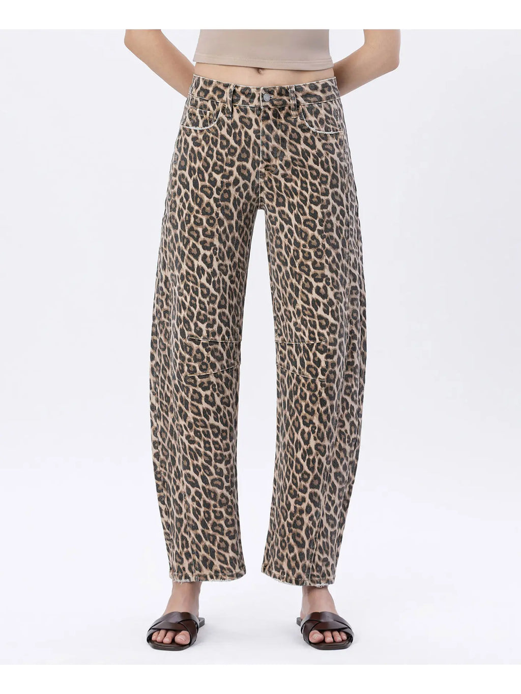 Leopard print pants worn by a person on a white background