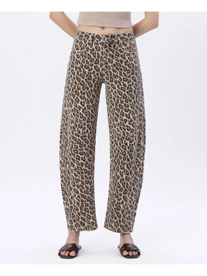 Leopard print pants worn by a person on a white background