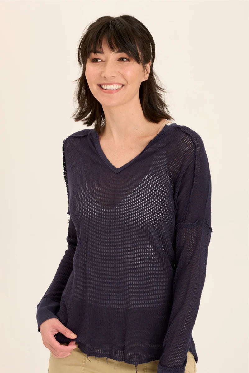 An exaggerated V-neck teams up with a drop shoulder look in our latest sweatshirt-like pullover. An airy mesh and rib details make Bullock oh-so-comfy and classy!