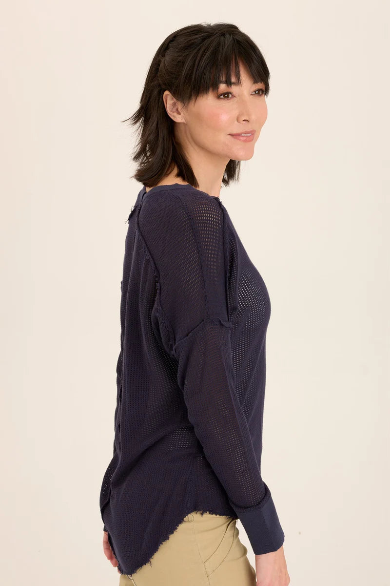 An exaggerated V-neck teams up with a drop shoulder look in our latest sweatshirt-like pullover. An airy mesh and rib details make Bullock oh-so-comfy and classy!