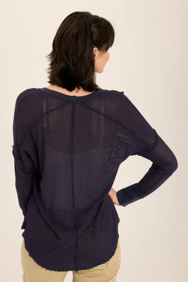 An exaggerated V-neck teams up with a drop shoulder look in our latest sweatshirt-like pullover. An airy mesh and rib details make Bullock oh-so-comfy and classy!