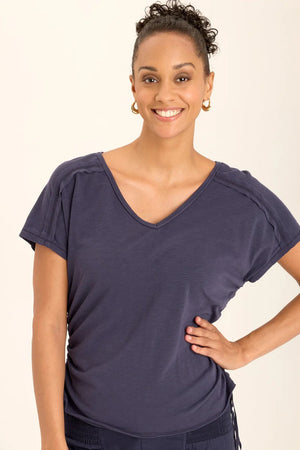 Cinchable side cords grace this v-neck slub jersey top; also featuring a front yoke, dolman sleeves, and raw-edge details throughout.