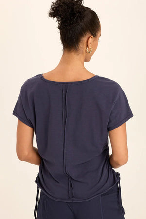 Cinchable side cords grace this v-neck slub jersey top; also featuring a front yoke, dolman sleeves, and raw-edge details throughout.