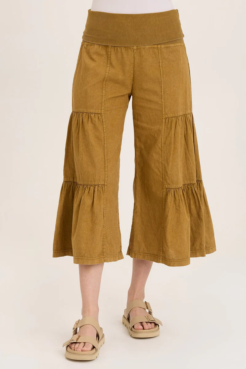 Mustard yellow wide-leg pants on a white background