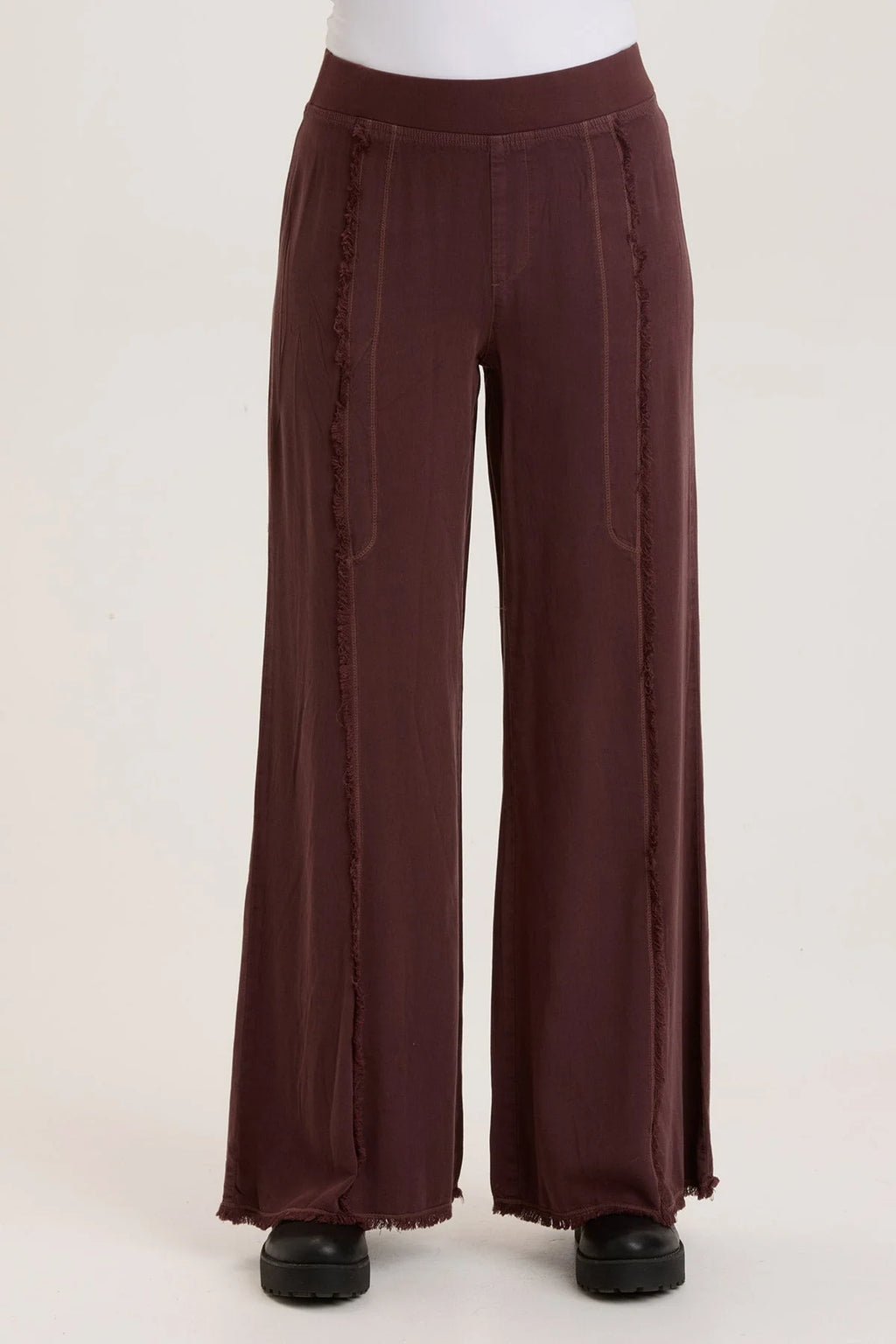 This wide leg trouser is now in our super soft Taissa. A pull-on elastic waistband and a faux fly, style lines with raw edges, back pockets, and raw edge hems.