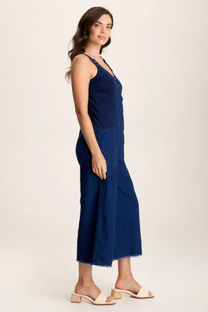 Indigo Twill offers a mock-denim look on this one-and-done ensemble, featuring cropped wide legs with a raw-edge hem, pockets at the front hips, adjustable overall straps, and ring snap-up closure.