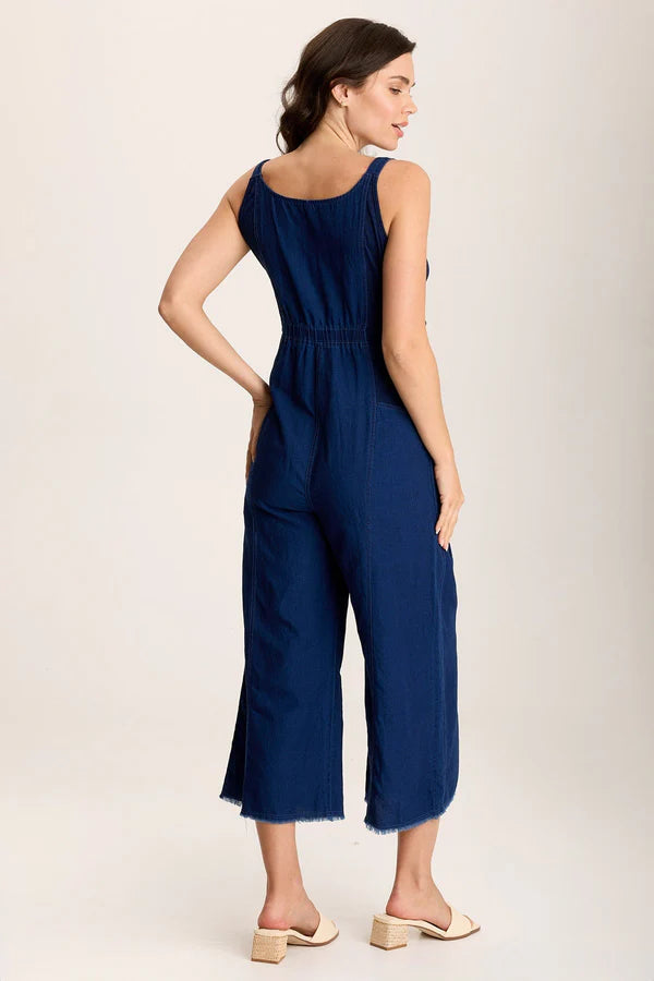 Indigo Twill offers a mock-denim look on this one-and-done ensemble, featuring cropped wide legs with a raw-edge hem, pockets at the front hips, adjustable overall straps, and ring snap-up closure.