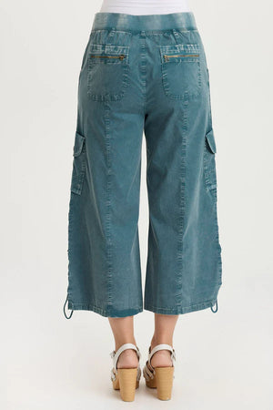 Teal cargo pants on a white background