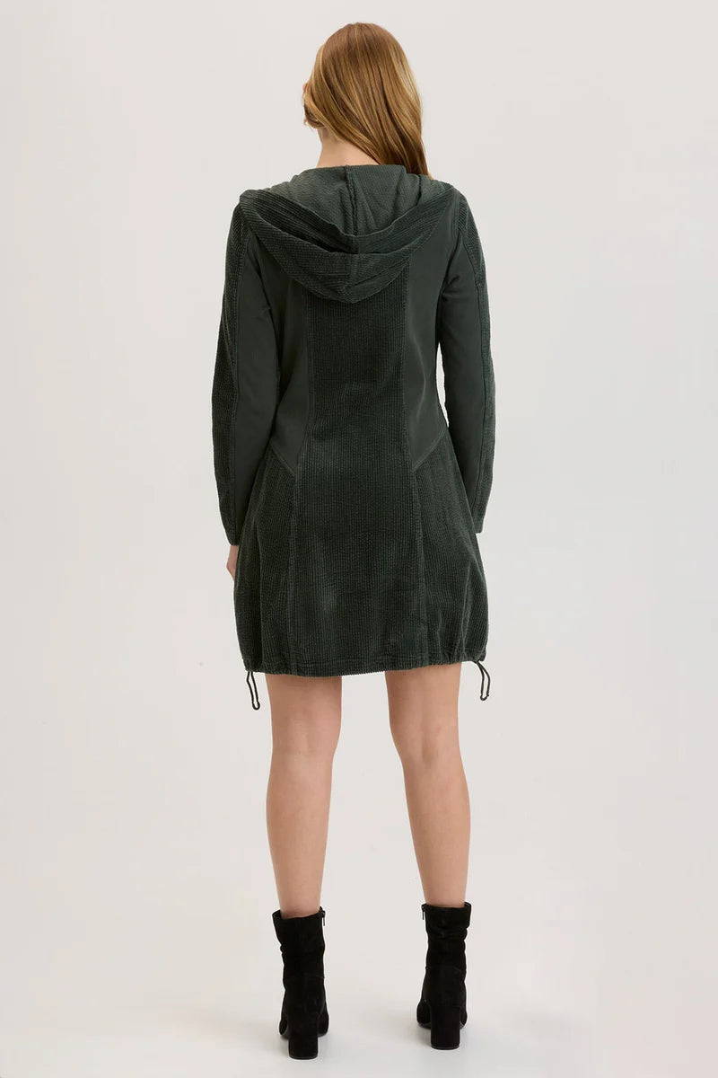 A hooded jacket dress featuring exaggerated pockets, cinchable bubble hem and brass hardware details.