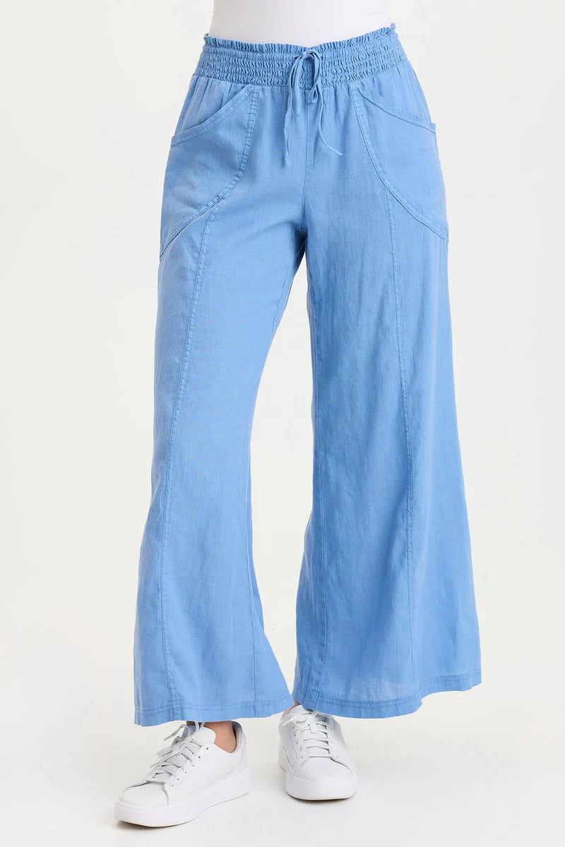 Light blue wide-leg pants worn by a person on a white background