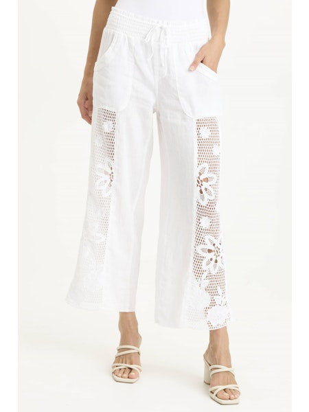 Step into effortless style with the XCVI Rokel wide-leg pants, featuring charming crochet side panels that add a touch of whimsy to your look. These breezy pants combine comfort and flair, perfect for playful days and relaxed evenings alike.