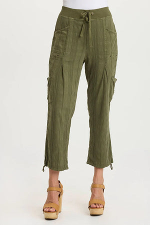 Green cargo pants worn by a person on a white background