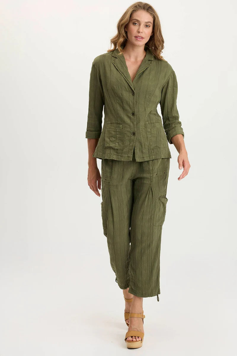 Woman wearing a green outfit on a white background