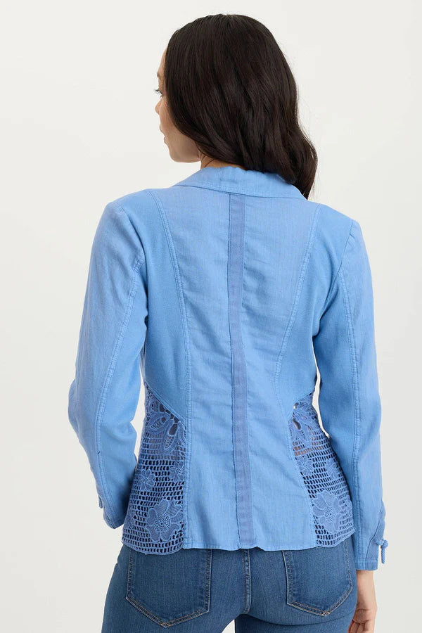 Light blue denim jacket with lace detailing on a plain background