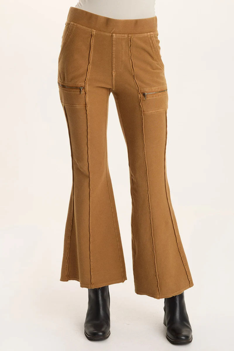 Brown flared pants on a white background