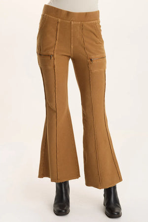 Brown flared pants on a white background