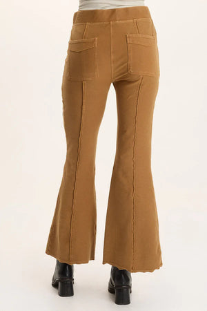Brown flared pants on a white background