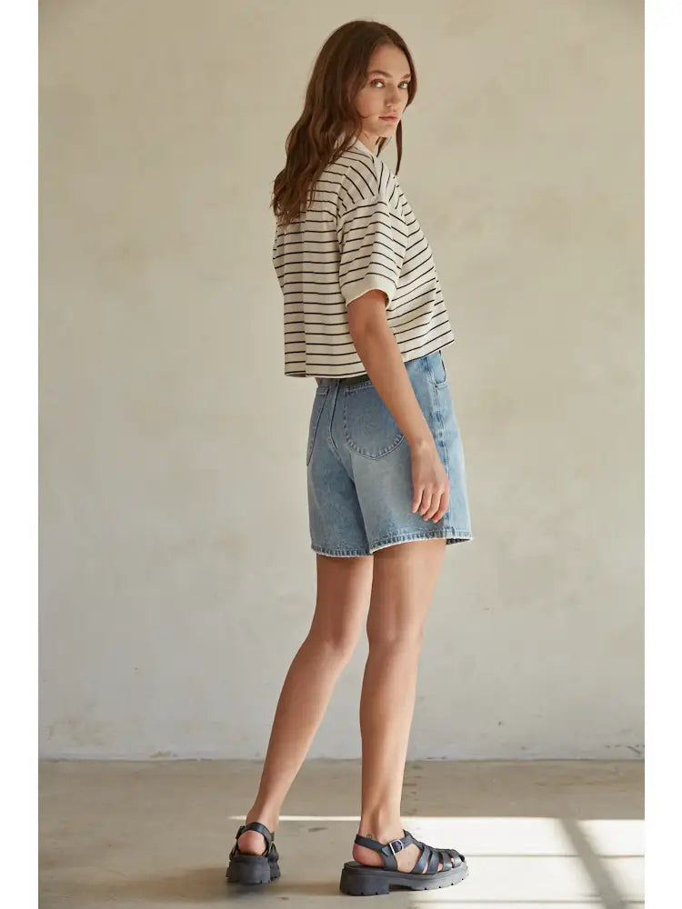 The By Together Riley top is a playful, yet stylish addition to your wardrobe. Made from soft knit fabric, this crop top features a striped collar and button down design, giving it a unique and quirky look. Perfect for those who want to stand out and have fun with their fashion choices.