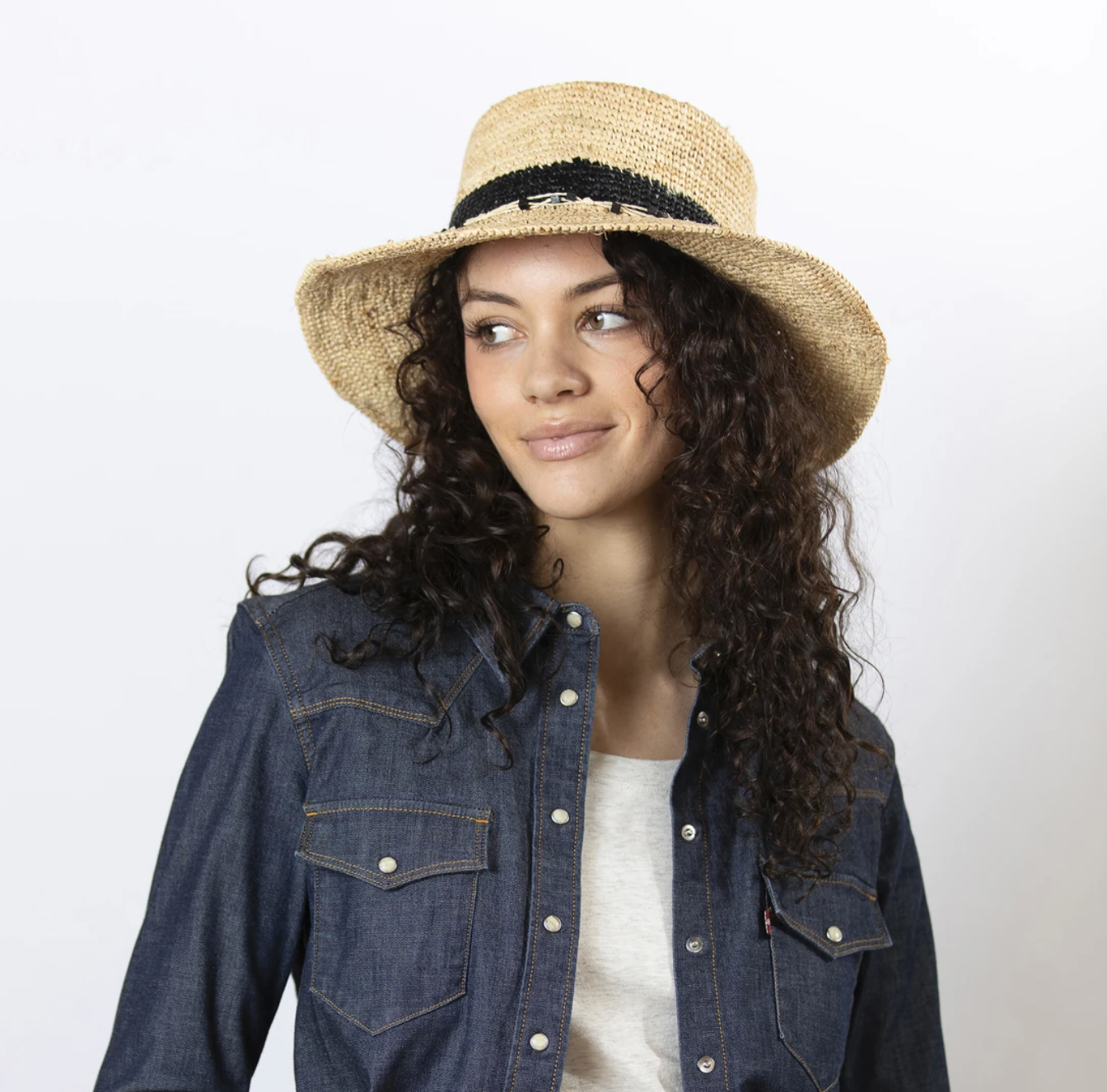 The women's Gia hat is made for sunny days that call for endless hours outside. The pretty raffia blend is lightweight and pliable with a smooth feel and a wide brim that keeps you covered on walks and picnics, or on lounge-filled, dreaming-of-vacation afternoons. Twisted strands of beaded raffia and a woven-in band of color add a fun, decorative touch. The flexible crown will form nicely to your head, with a soft band inside to keep you comfortable.