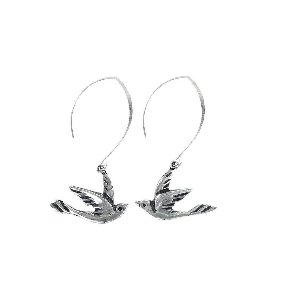 A pair of silver-plated bronze earrings in the shape of doves with a 2 1/4" drop.