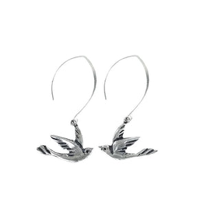 A pair of silver-plated bronze earrings in the shape of doves with a 2 1/4" drop.